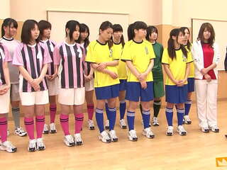 Japanese female team listen and take a lesson from their coach